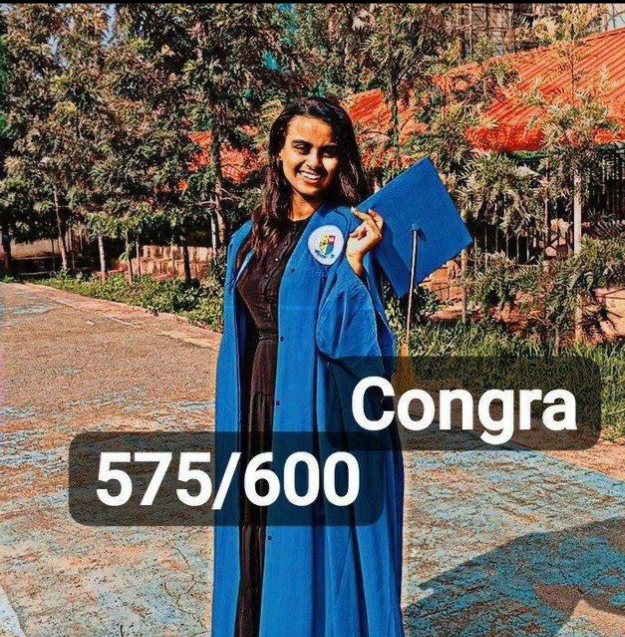 Sifene Erkossa in graduation attire with 575/600 score